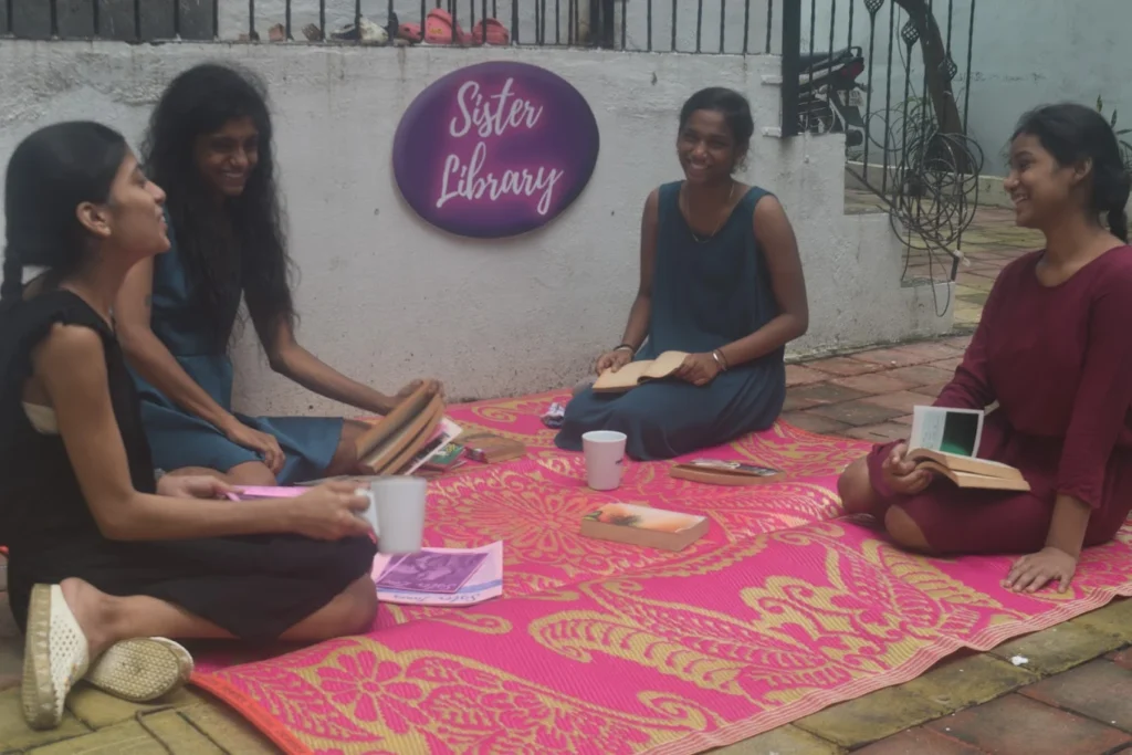 Inside view of Sister Library in Bandra West, Mumbai — cozy reading space with curated books by female authors, warm lighting, and peaceful ambiance near Taj Mahal Tea House.